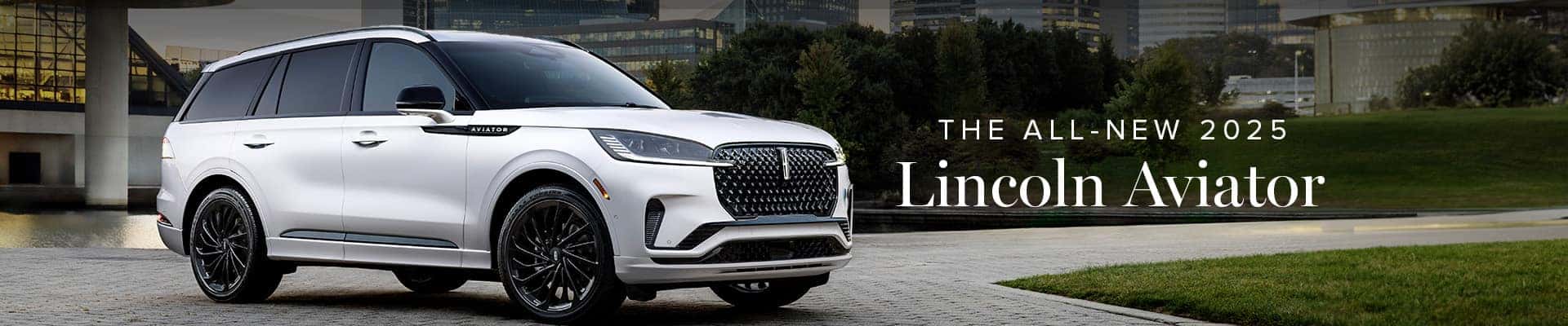 2025 Lincoln Aviator SUV parked outdoors near modern architecture.