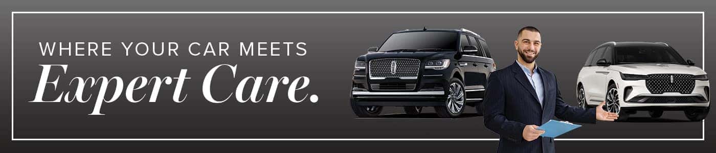 "Where your car meets expert care" with two luxury SUVs and a smiling man in a suit holding a clipboard.