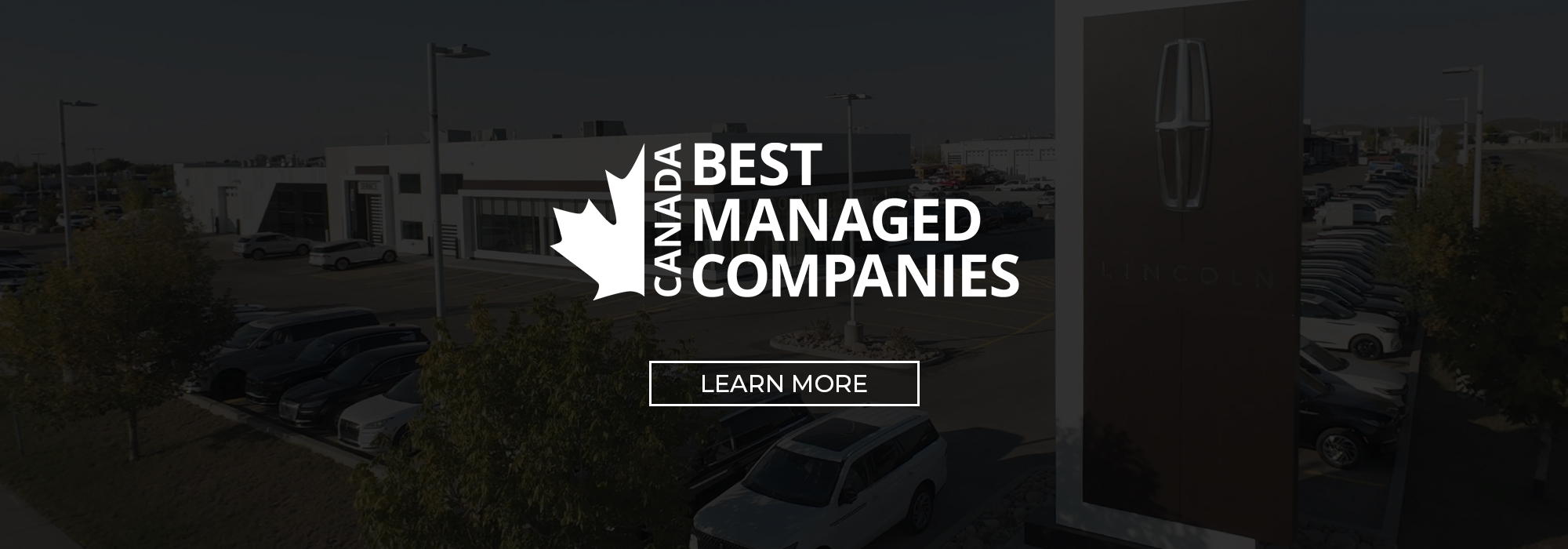Outdoor view of a car dealership with a Lincoln sign, labeled "Canada Best Managed Companies."